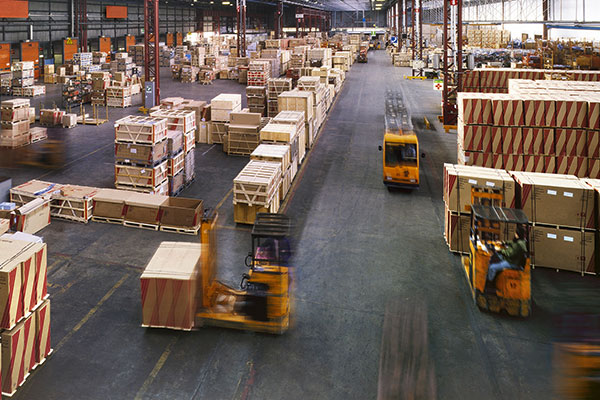 Warehouse with forklift trucks